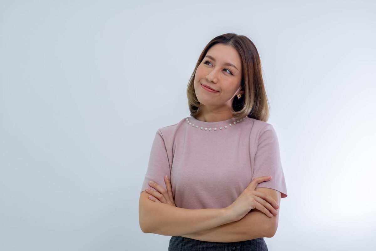 woman in pink blouse wondering about water damage