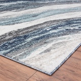 Image of a modern design rug on a wood floor