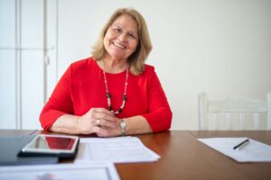 a woman with documents on the table