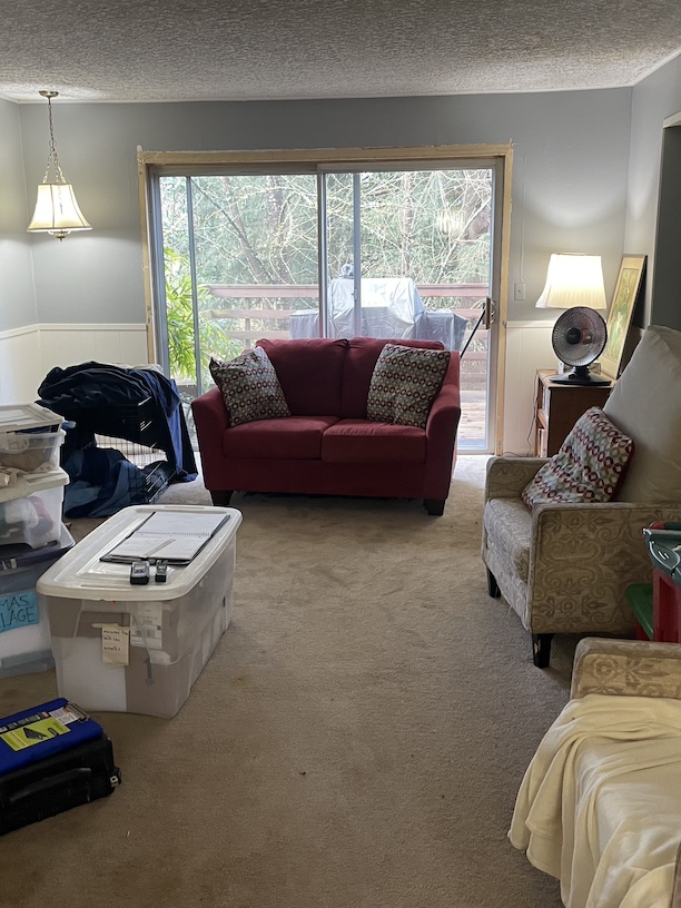 Image of a living room after water damage occurred, and was being inspected.